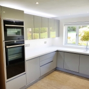 Handleless kitchen supplied by Taps and Tubs